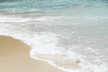Waves of turquoise water Beach. Beautiful sandy beach and blue sea waves