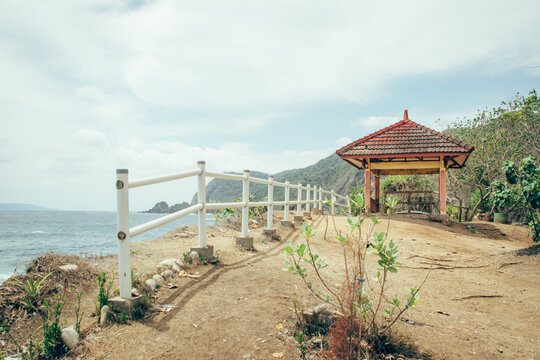 View of the Gazebo on the beach. Tanjung Papuma Beach in Jember, Indonesia. Beautiful beach with Batu Island.