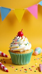 Delicious cupcake topped with frosting and a cherry, perfect for celebrations.