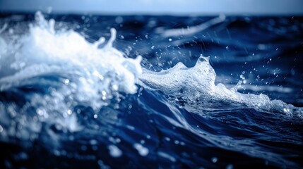 Fototapeta premium view of small waves producing bubbles