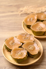 Sticky rice cake (Nian Gao), Chinese New Year cake on wooden plate