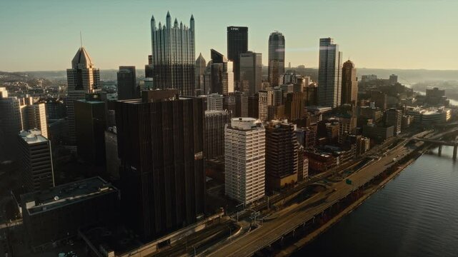 4K drone flying over city skyline of Pittsburgh, Pennsylvania. One PPG Place at the center.