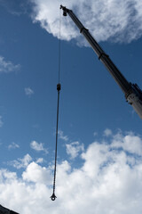Obraz premium Construction tower cranes on a building site with blue sky background.