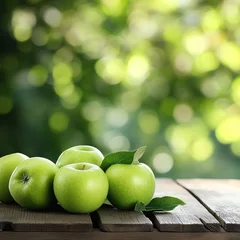 Fresh green apples on wooden table, orchard background, healthy food © Fenny