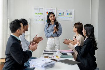A group of people are clapping