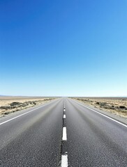Fototapeta premium Asphalt road stretches out to meet the eye from beneath a clear blue sky on a sunny day, paved road, concrete, long road