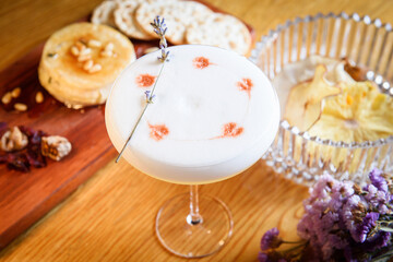Elderflower Shower Cocktail in a round, tall glass
