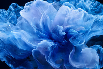 Smoke, in a blue color on a black background, high-resolution photography. 
