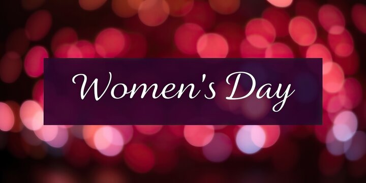 A beautiful banner dedicates International Women's Day, featuring elegant script on a purple background infused with colorful bokeh lights, celebrating women's achievements
