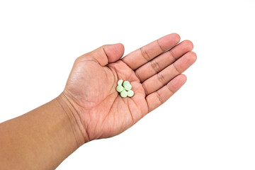 Hand holding medicine pills isolated on white background