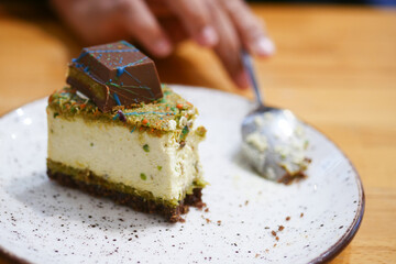A Slice of Delicious Cheesecake Topped Generously with Chocolate