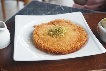 Turkish dessert kunefe, kunafa, kadayif with pistachio 