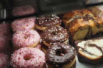 chocolate donuts display for sale at local store 