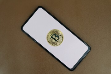 Bitcoin on a white smartphone screen