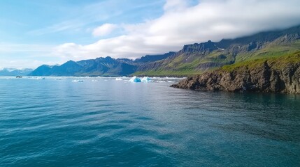 Fototapeta premium Icelandic fjord boat tour, glacial icebergs, mountain backdrop, sunny day