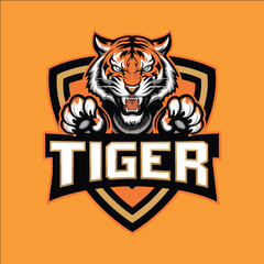 Obraz premium A tiger logo with a fierce look on its face. The tiger is shown in a bold orange and black color scheme