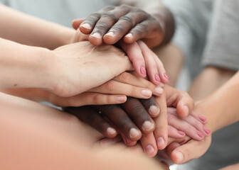 close up. young people making a tower of hands.