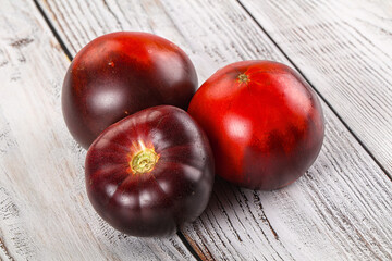 Black ripe juicy organic tomato
