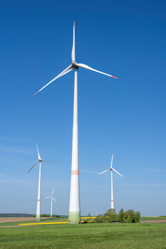 Modern wind energy plants with agricultural fields seen in Germany