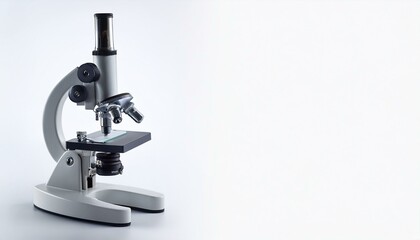 A close-up shot of a microscope against a white background.