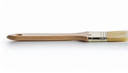 Naklejka premium Close-up of a paintbrush with a wooden handle and natural bristles.