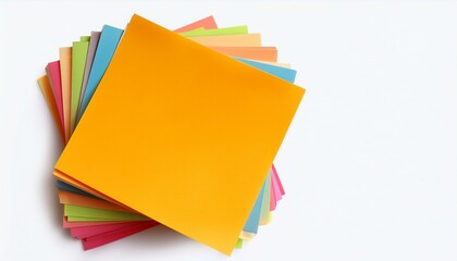 Stack of colorful memo pads on white background.