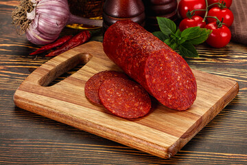 Spicy pepperoni sausages with sliced piece