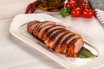 Sliced duck breast baked with cherry