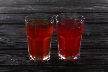 Red compote on black wooden background © Pretti