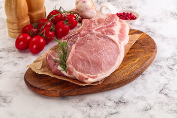 Raw potk loin steak with bone