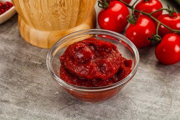 Red tomato paste in the bowl