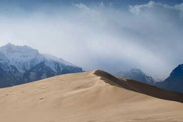 Russia. Beautiful scenery of the northernmost desert in the world. View of the Kodar Ridge. Chara sands. The region of baikaL Kodar National natural park. .