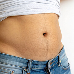 First Stage Of Belly Fat, Men's Belly fat Started Growing From An Unhealthy Lifestyle Isolated On White Background