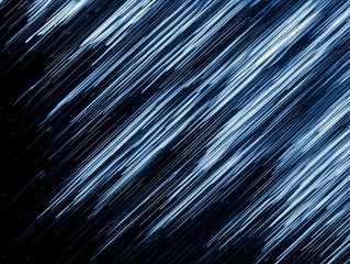 Obraz premium Abstract Background Creates Dynamic Diagonal Blue Lines with Speed and Motion Effect with Dark Background