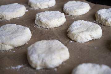 Culinary background. Cookie dough on baking paper.