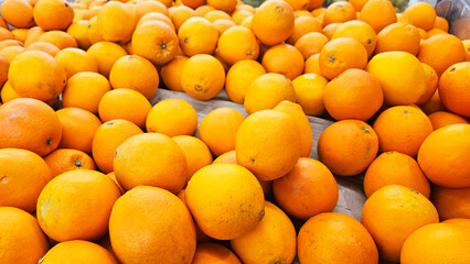 Orange Abundance: A vibrant pile of fresh, juicy oranges overflows with color and the promise of sweetness.