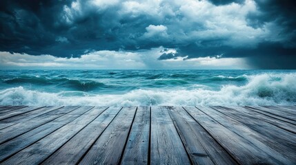 Fototapeta premium A wooden dock stretches into a turbulent ocean under a moody sky.