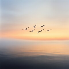 Fototapeta premium Birds Flying Over Calm Ocean at Sunset