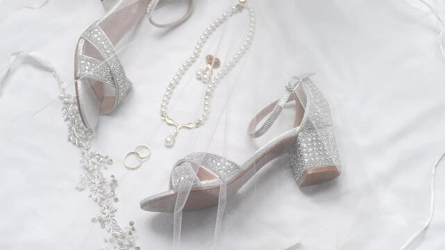 rings, earrings with diamonds and pearl bride heels