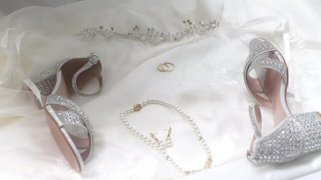 rings, earrings with diamonds and pearl bride heels