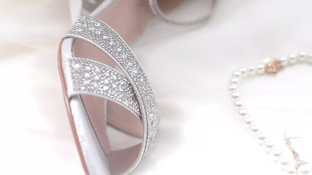 rings, earrings with diamonds and pearl bride heels