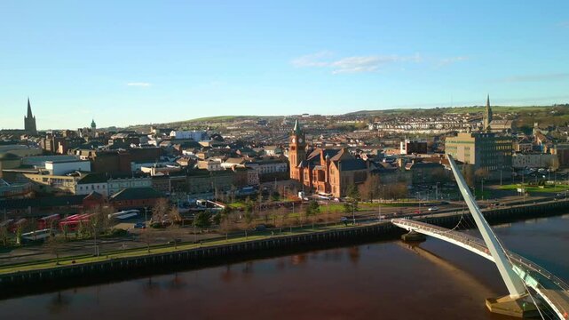 Aerial shot of the Peace Bridge and Guildhall in Derry-Londonderry, NI. Filmed in 4K at 60fps and in Rec709 color space.