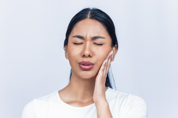 Beautiful woman with toothache touching her face on isolated on white