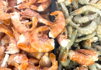 A pile of shrimp and a pile of shrimp wings