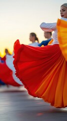 Colorful street dancers captivate during festive sunset performance in vibrant costumes