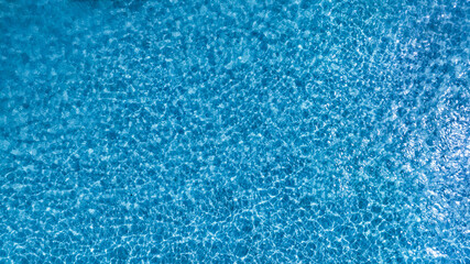 Top view beach sand background for summer vacation concept. Beach nature and summer seawater with sunlight light sandy beach Sparkling sea water 