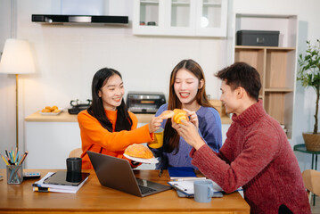 Teamwork and creativity with young adults collaborating on laptops and tablets