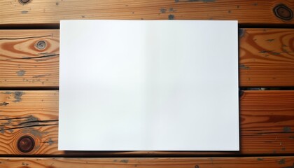 Naklejka premium Blank white paper lies on wooden table. Natural wood texture shows with light brown color, dark marks. Paper ready for notes design. Great for presentations templates. Empty paper sheet on rustic