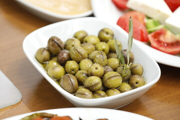 Mixed breakfast in nature with green olive's, healty food