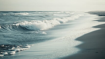 Gentle waves caress sandy shore under soft morning light, creati
